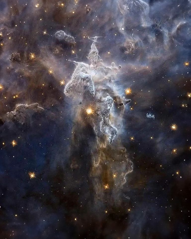 The Carina Nebula, a breathtaking celestial masterpiece nestled 7500 light-years away.